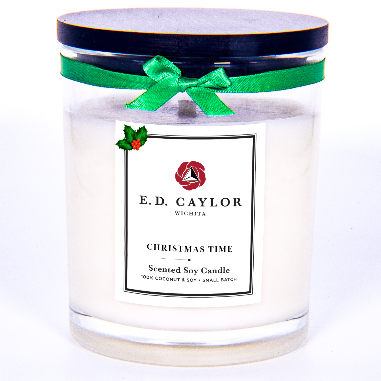 Scented candle with a green ribbon and E.D. Caylor label on a white background